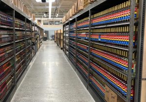 Shelves stocked with syrup bottles