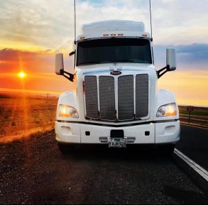 HTrans truck during a sunset